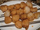 Click photo for more images!Caption: Marinated scallops on skewers, on their way to the grill.