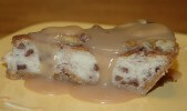 Caption: Caramelized Banana Cheesecake with a pecan caramel sauce