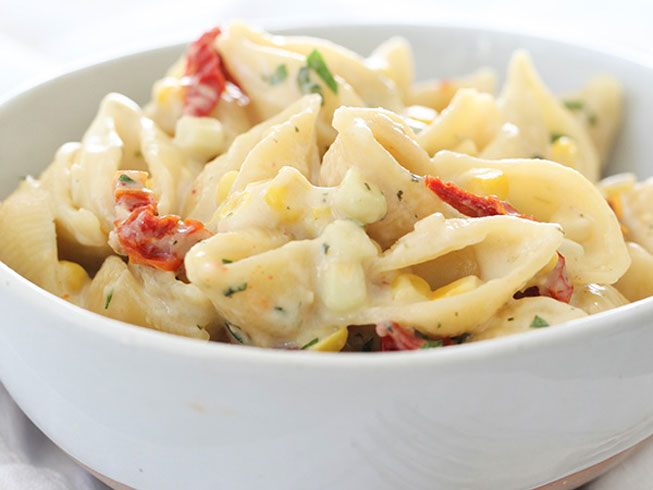 Stovetop Pesto Macaroni and Cheese with Corn and Sun-Dried Tomatoes