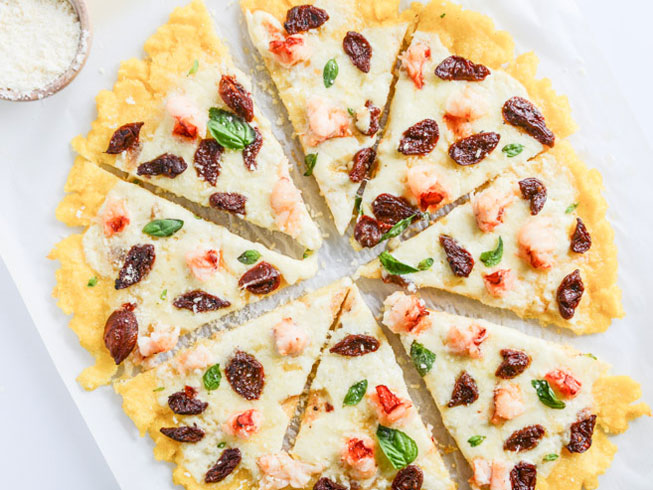 Lobster Polenta Pizza with Sun Dried Cherry Tomatoes.