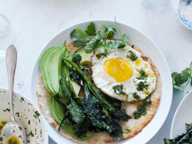Roasted broccoli rabe tostada with avocado, fried egg and chimichurri